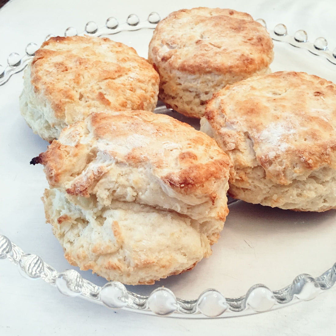 A plate of four biscuits