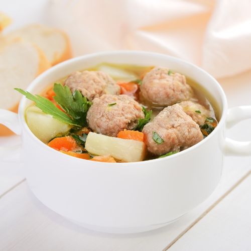 A white bowl of Ground Turkey Soup