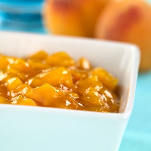 A serving dish of peach cobbler