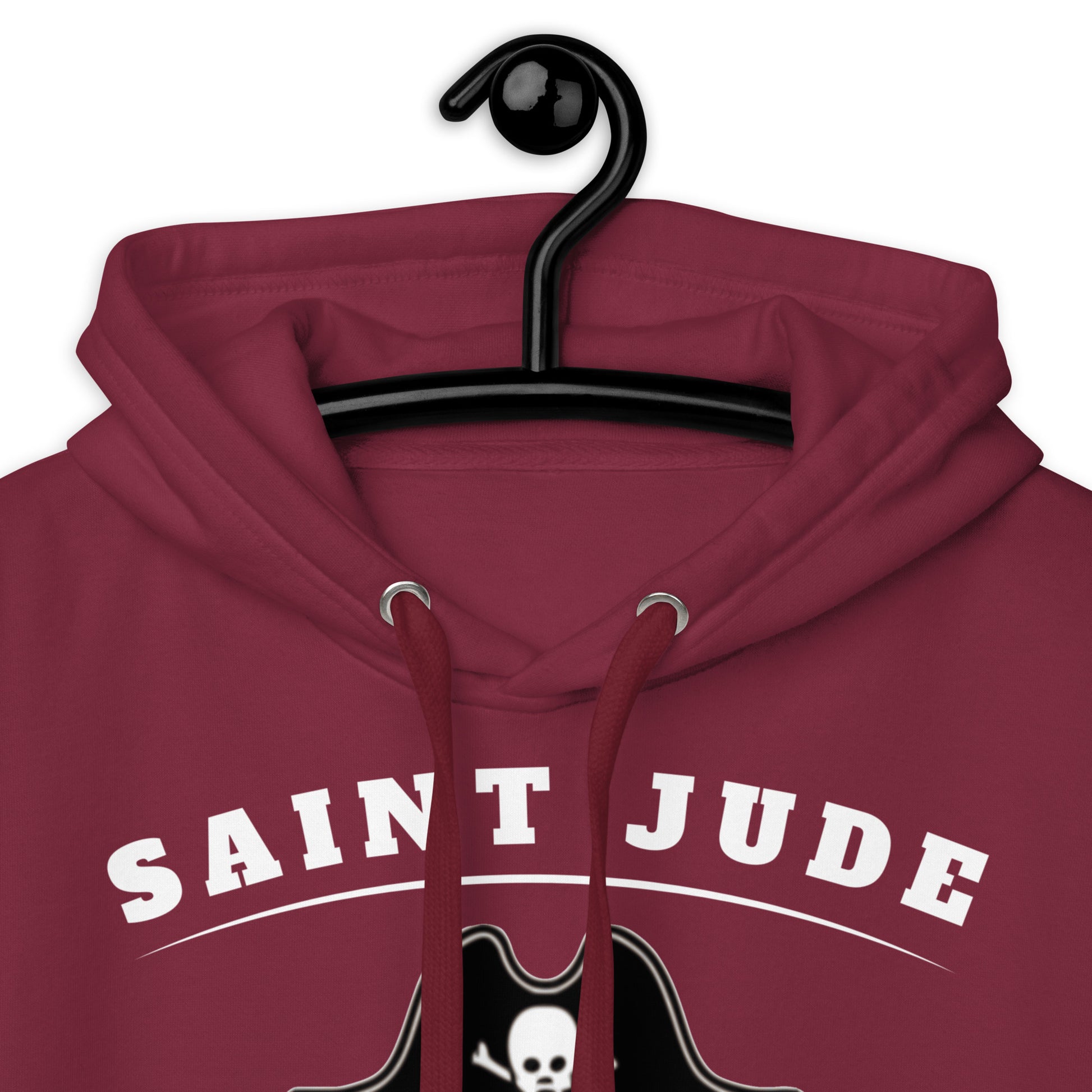 A close up of the Saint Jude High School Hoodie showing the flat drawstrings hanging on a black hanger