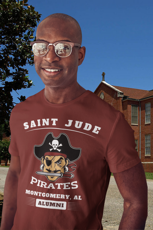 A guy standing in front of the former St. Jude High School wearing The Saint Jude High School T-shirt in maroon 