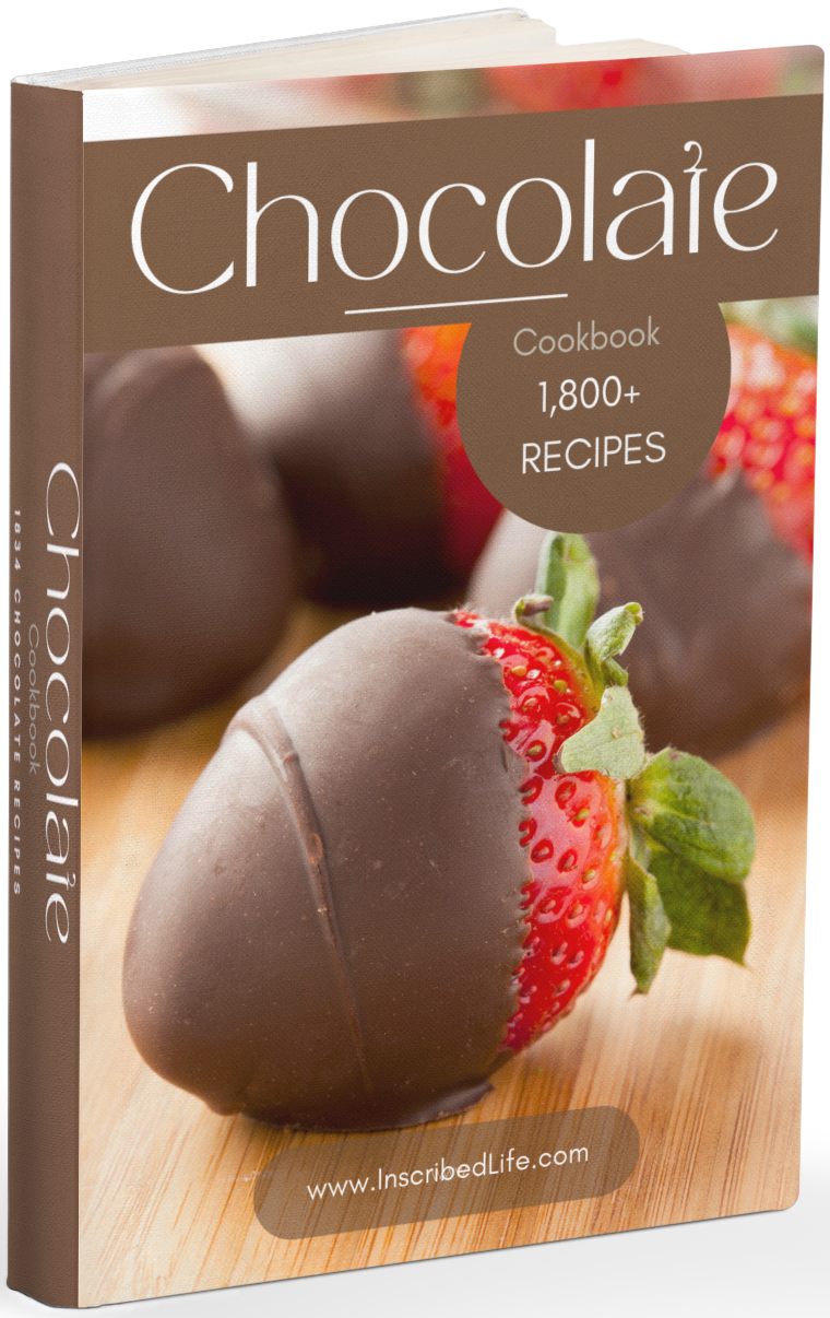 A mockup of the Chocolate Cookbook displaying chocolate-covered strawberries on a wood grain surface